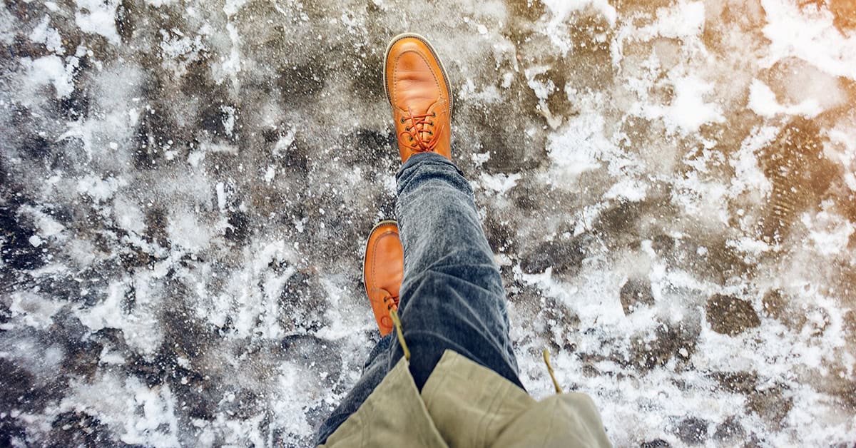 Icy pavement looking down on shoes walking, credit ID 1253405032 by V_Sot_Visual_Content, Shutterstock.com